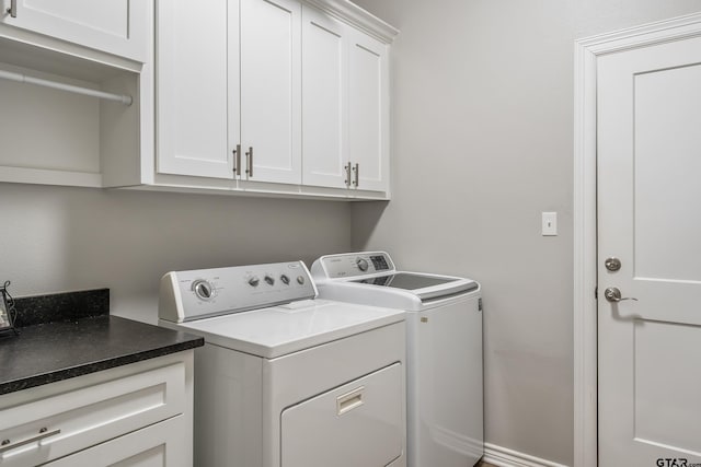 laundry area featuring cabinet space and washing machine and clothes dryer