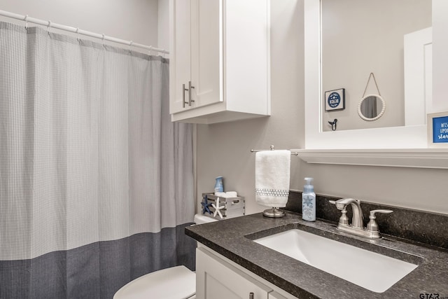 full bathroom featuring toilet and vanity