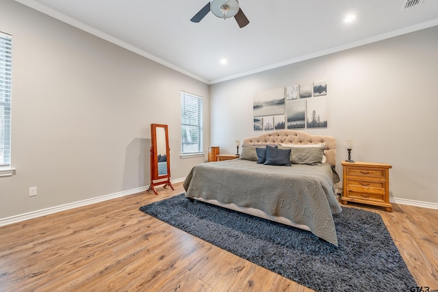 bedroom featuring baseboards, a ceiling fan, ornamental molding, wood finished floors, and recessed lighting