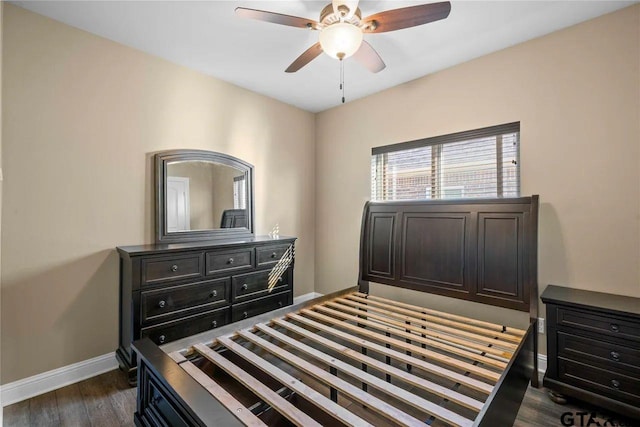 bedroom featuring ceiling fan and dark hardwood / wood-style floors