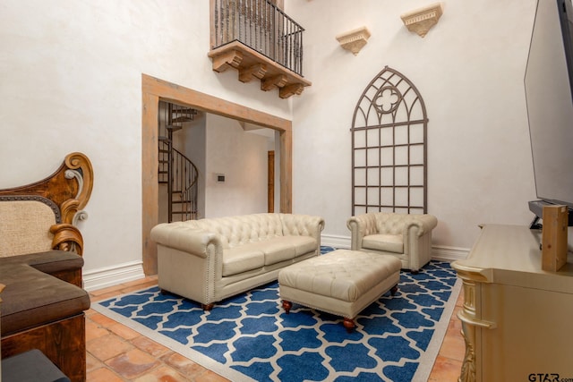 living room featuring a towering ceiling