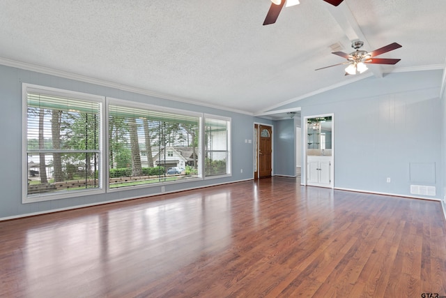 unfurnished living room with a ceiling fan, vaulted ceiling with beams, wood finished floors, visible vents, and ornamental molding