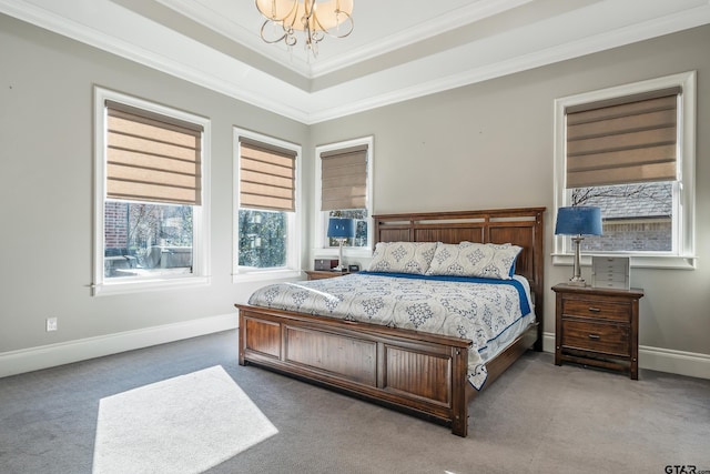 bedroom with carpet, crown molding, baseboards, and an inviting chandelier