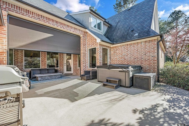 view of patio featuring a grill and a hot tub