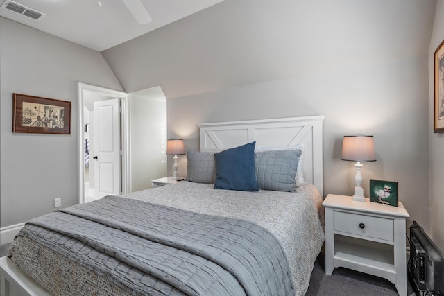 carpeted bedroom featuring a ceiling fan, lofted ceiling, and visible vents