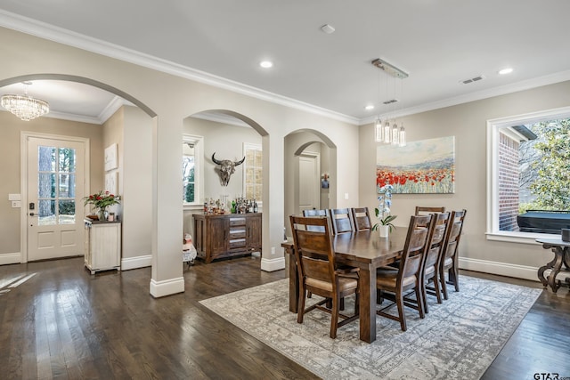 dining room with visible vents, baseboards, dark wood-type flooring, crown molding, and recessed lighting