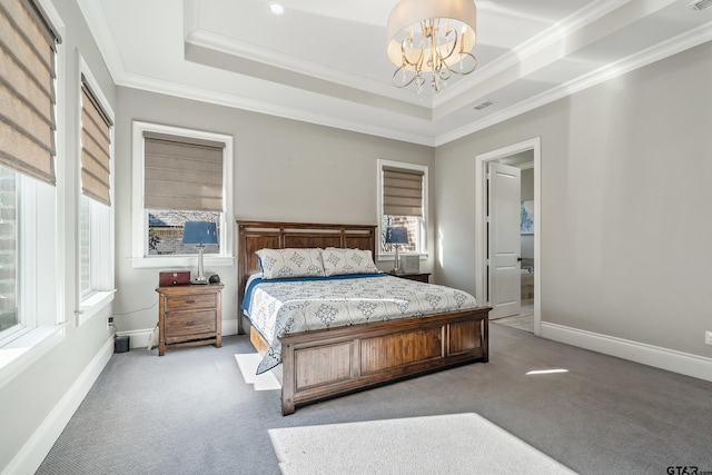 bedroom with a raised ceiling, multiple windows, crown molding, and carpet flooring