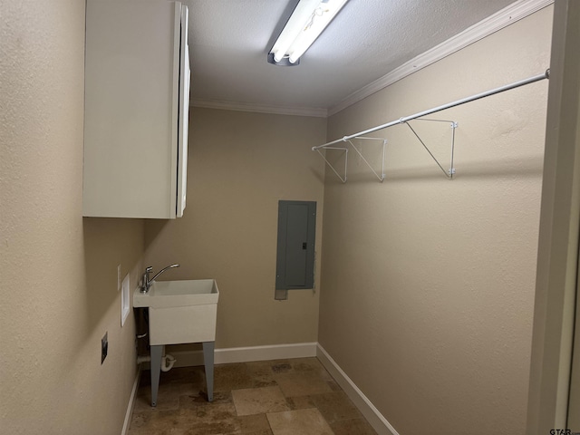 8856 Pleasant Hill Cir, Tyler, TX 75707 - washroom with baseboards, stone finish floor, ornamental molding, and electric panel