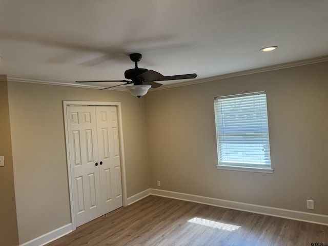 8856 Pleasant Hill Cir, Tyler, TX 75707 - unfurnished bedroom with crown molding, wood finished floors, and baseboards