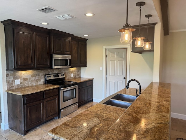 8856 Pleasant Hill Cir, Tyler, TX 75707 - kitchen with baseboards, visible vents, stainless steel appliances, and a sink