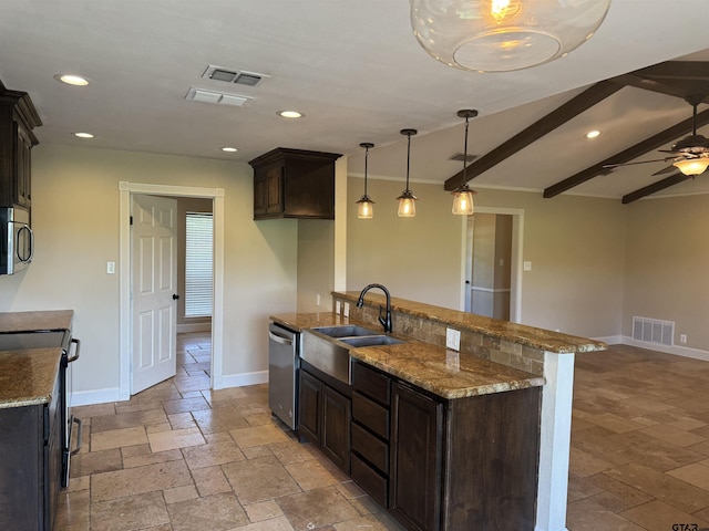 8856 Pleasant Hill Cir, Tyler, TX 75707 - kitchen featuring a sink, stone tile flooring, stainless steel appliances, dark brown cabinets, and visible vents