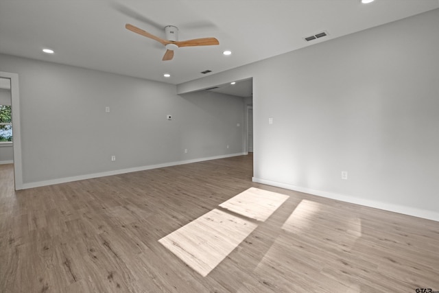 unfurnished room with ceiling fan and light hardwood / wood-style flooring