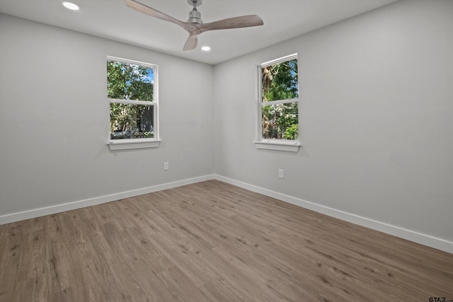 unfurnished room with wood-type flooring and ceiling fan