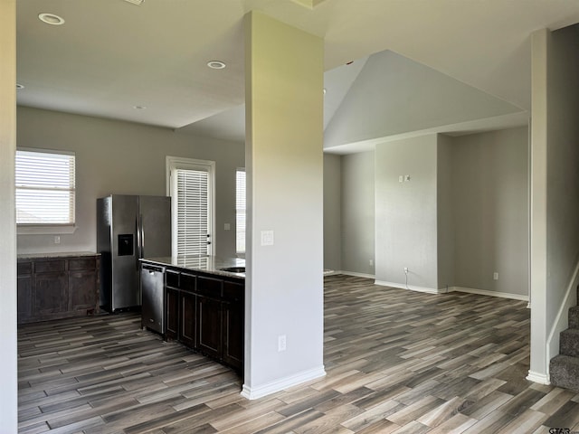 kitchen featuring dark brown cabinets, light wood-type flooring, and appliances with stainless steel finishes