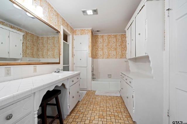 bathroom with vanity and bathing tub / shower combination