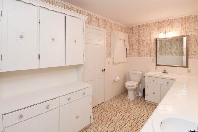 bathroom with vanity, tile patterned floors, and toilet