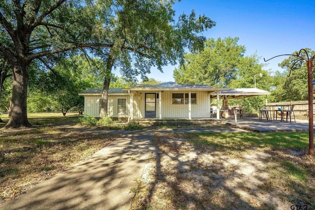 ranch-style house featuring a patio area