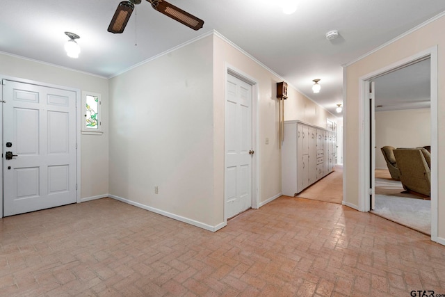 foyer entrance featuring ceiling fan and crown molding