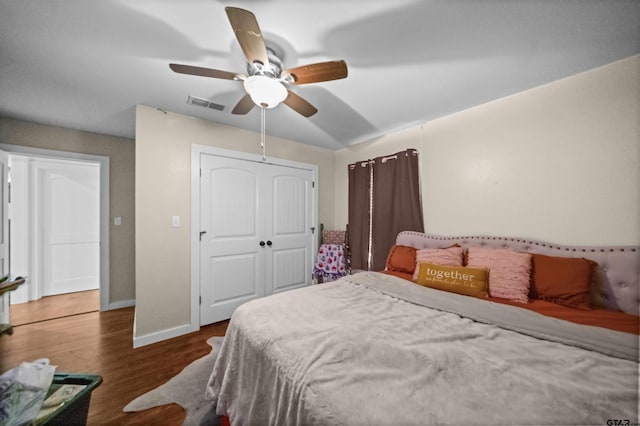 1325 Fm 23 W, Rusk, TX 75785 - bedroom featuring wood finished floors, a closet, baseboards, and ceiling fan