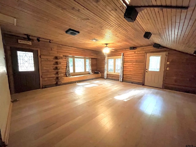 bonus room featuring hardwood / wood-style floors, wood ceiling, vaulted ceiling, and rustic walls