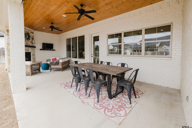 view of patio featuring an outdoor living space, outdoor dining area, and ceiling fan