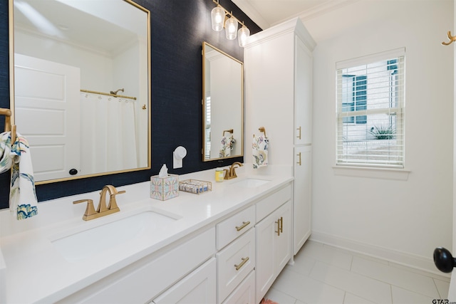 full bathroom with a sink, baseboards, ornamental molding, and double vanity