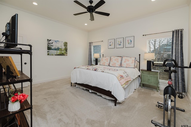 bedroom featuring crown molding, baseboards, light carpet, recessed lighting, and a ceiling fan