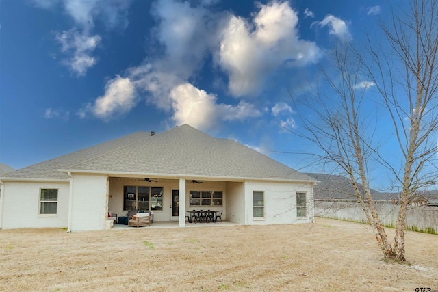 back of property featuring a patio, a shingled roof, a ceiling fan, and fence