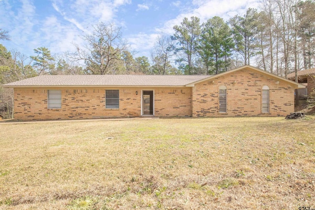 ranch-style home with a front yard