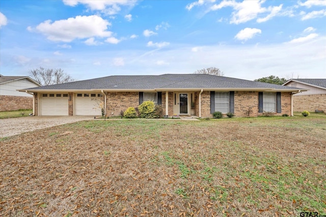 ranch-style home with a garage and a front lawn