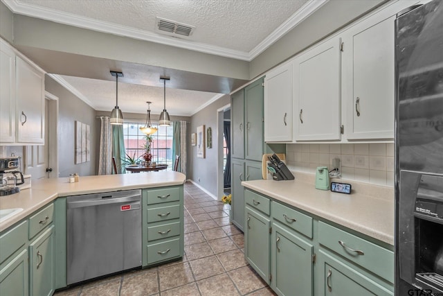 kitchen featuring pendant lighting, dishwasher, white cabinets, ornamental molding, and tasteful backsplash