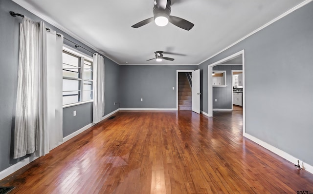 507 Bascom Rd, Whitehouse, TX 75791 - unfurnished room featuring a ceiling fan, crown molding, stairway, and hardwood / wood-style floors