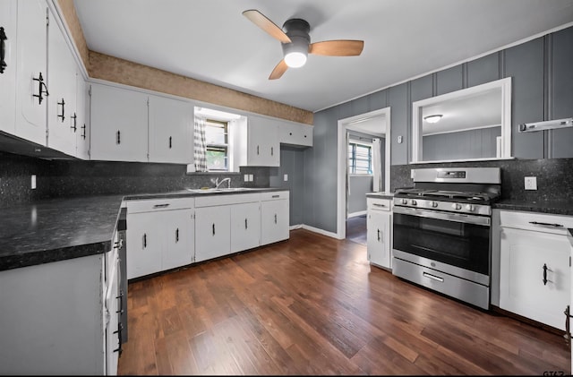507 Bascom Rd, Whitehouse, TX 75791 - kitchen featuring stainless steel gas stove, a ceiling fan, decorative backsplash, and dark countertops