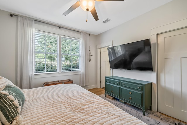 bedroom featuring visible vents and ceiling fan