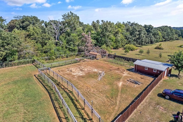 birds eye view of property with a rural view