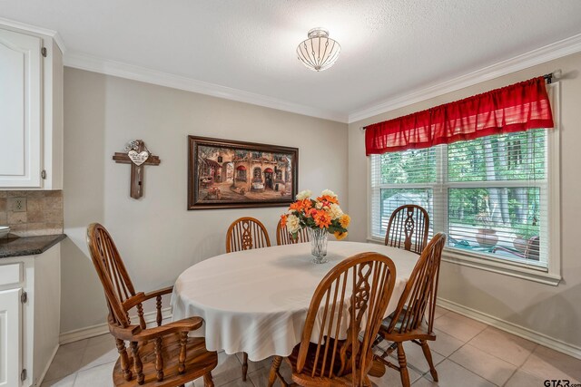 110 Leisure Ln, Whitehouse, TX 75791 - dining area featuring crown molding, light tile patterned floors, and baseboards