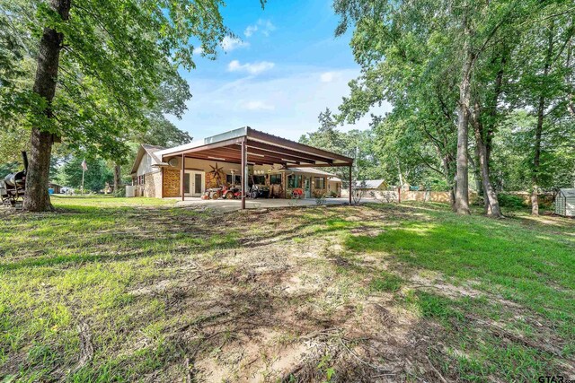 110 Leisure Ln, Whitehouse, TX 75791 - exterior space featuring a yard, ceiling fan, fence, and a patio