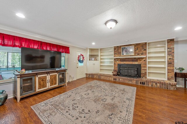 110 Leisure Ln, Whitehouse, TX 75791 - living room featuring a fireplace, baseboards, crown molding, and a textured ceiling