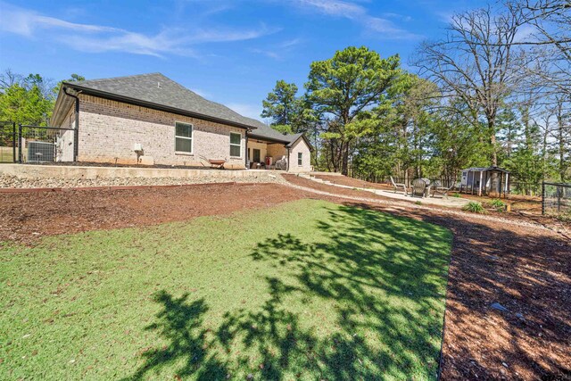 15920 Shepards Gln, Lindale, TX 75771 - view of yard with a patio, fence, and an outdoor structure