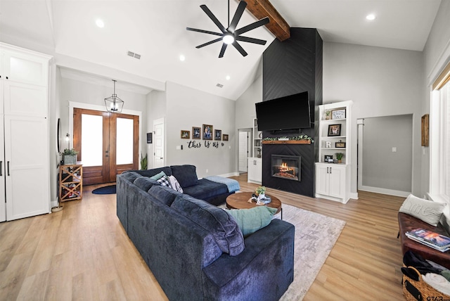 15920 Shepards Gln, Lindale, TX 75771 - living area with visible vents, light wood-type flooring, a fireplace, high vaulted ceiling, and a ceiling fan