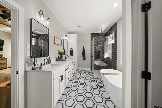15920 Shepards Gln, Lindale, TX 75771 - bathroom with a freestanding tub, a stall shower, a sink, tile patterned flooring, and double vanity