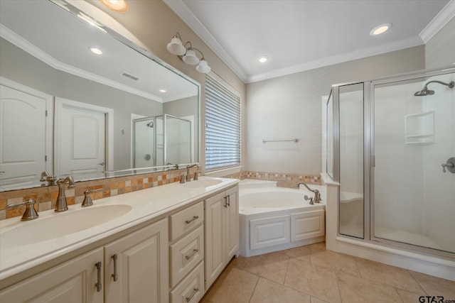 bathroom featuring crown molding, vanity, separate shower and tub, and tile patterned floors