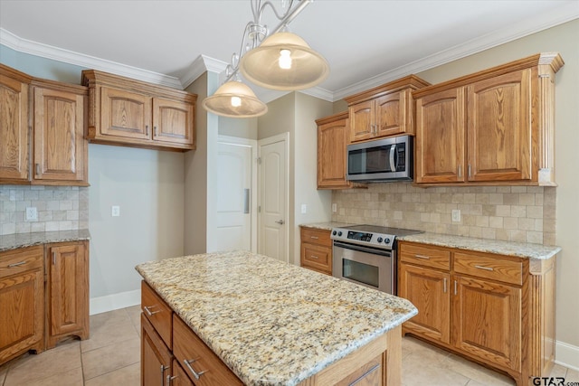 665 Bunker Dr, Tyler, TX 75703 - kitchen featuring stainless steel appliances, light stone counters, backsplash, brown cabinets, and ornamental molding