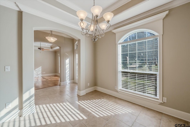 unfurnished room featuring ceiling fan with notable chandelier, ornamental molding, and plenty of natural light