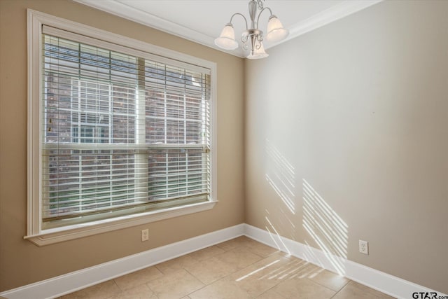 tiled spare room featuring an inviting chandelier and crown molding