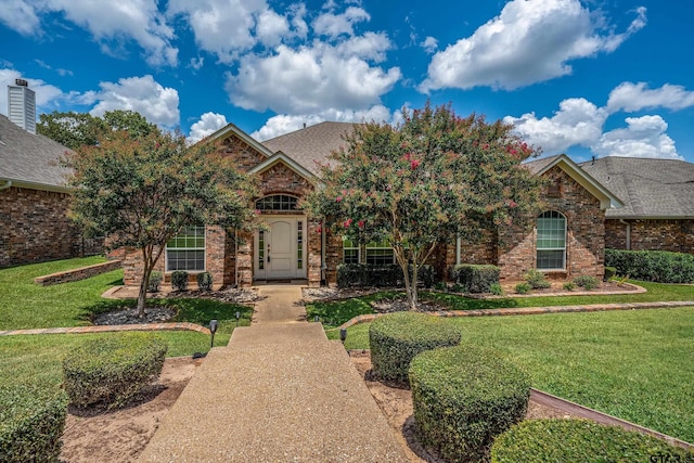 665 Bunker Dr, Tyler, TX 75703 - view of front of property with a front yard and brick siding