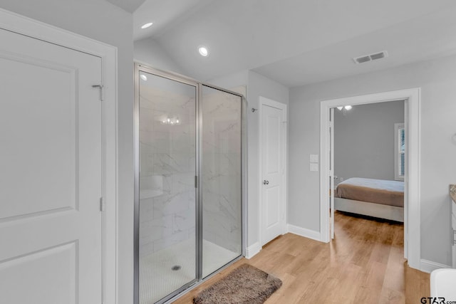 19175 Seneca Dr, Flint, TX 75762 - bathroom with a marble finish shower, ensuite bath, wood finished floors, recessed lighting, and lofted ceiling