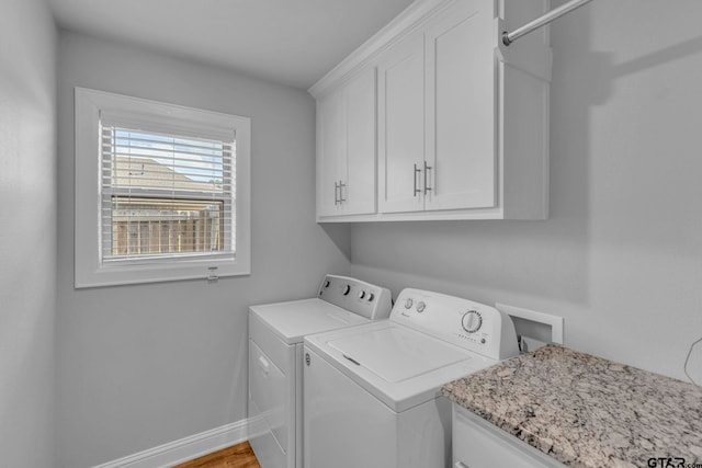 19175 Seneca Dr, Flint, TX 75762 - laundry room with cabinet space, washer and clothes dryer, and wood finished floors
