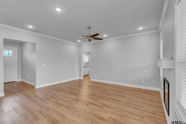 19175 Seneca Dr, Flint, TX 75762 - unfurnished living room featuring ceiling fan, recessed lighting, a large fireplace, light wood-style floors, and ornamental molding