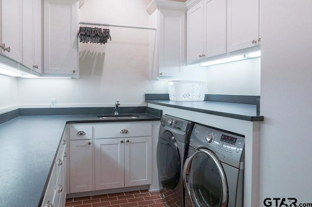 laundry room with washer and clothes dryer, a sink, and cabinet space